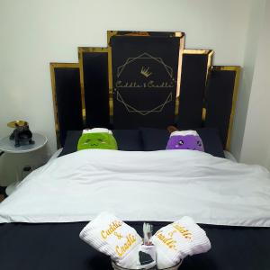 a bed with two stuffed animals sitting on it at Cuddle & Cradle Staycation at The Celandine in Manila +19 photos