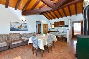 a living room with a couch and a table at Apartments Bale 1945 in Bale