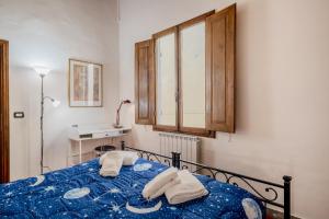 Posteľ alebo postele v izbe v ubytovaní Heart of Florence - San Lorenzo Lovely Apartment
