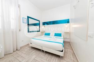 Postel nebo postele na pokoji v ubytování Di Ma B&B