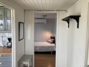 Postel nebo postele na pokoji v ubytování Slimmingegården 1019