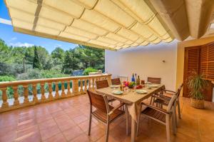 a dining room with a table and chairs on a balcony at Ideal Property Mallorca - Tacaritx in Cielo de Bonaire 