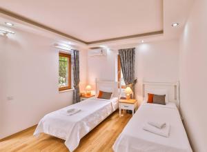 Ένα ή περισσότερα κρεβάτια σε δωμάτιο στο Paradise Villa Kaş Central Luxury Villa with Sauna +29 φωτογραφίες