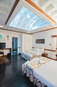 Кровать или кровати в номере Villa Jhoana Resort