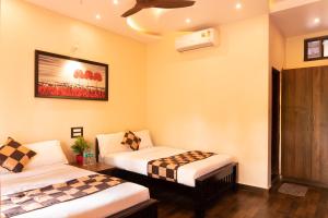Ένα ή περισσότερα κρεβάτια σε δωμάτιο στο River Point Dandeli