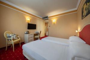 Ένα ή περισσότερα κρεβάτια σε δωμάτιο στο iH Hotels Padova Admiral