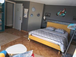 a bedroom with a bed in a room at Chambres d'Hôtes de l'Avison in Bruyères +26 photos