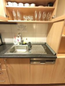 a kitchen with a sink and a counter top at CozyGem House 2" walk Charles Bridge in Prague