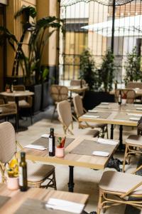 a row of tables and chairs in a restaurant at Hospes Amérigo, Alicante, a Member of Design Hotels in Alicante