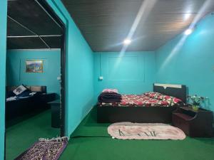 Postel nebo postele na pokoji v ubytování Pradhan Homestay Mirik - Homestay beside Mirik Lake