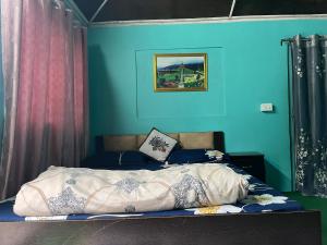 Postel nebo postele na pokoji v ubytování Pradhan Homestay Mirik - Homestay beside Mirik Lake