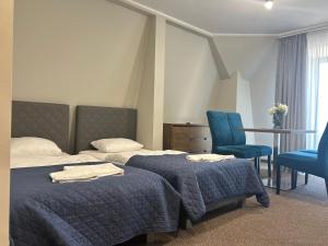 Postel nebo postele na pokoji v ubytování Apartamenty CityCenter