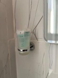 a cup on a holder on a wall in a bathroom at Wadi rum Ali camp in Wadi Rum +94 photos