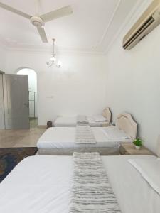 A bed or beds in a room at Leyla Hostel