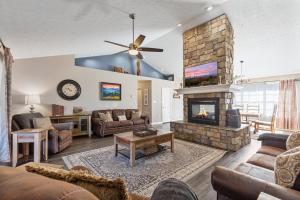 a living room with a couch and a fireplace at A Dolly Good Time in Sevierville