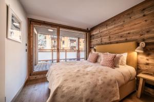 Postel nebo postele na pokoji v ubytování Apartment Heriz, Les Gets - by EMERALD STAY