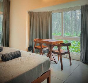 Postel nebo postele na pokoji v ubytování Forestscape Resort Munnar