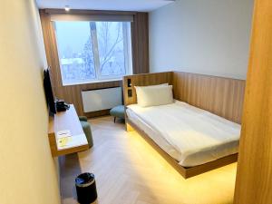 Postel nebo postele na pokoji v ubytování Resident Hotel Abay
