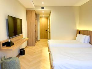 TV a/nebo společenská místnost v ubytování Resident Hotel Abay