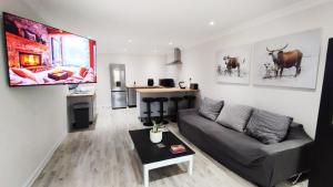 a living room with a couch and a table at Dinas Accommodation Flat 3 in Oranjemund