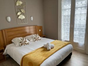 Postel nebo postele na pokoji v ubytování Le Relais De La Place + 37 fotografií