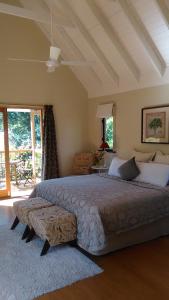 a bedroom with a large bed in a room at The Old Church Bed and Breakfast in Boonah