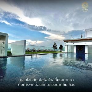 a swimming pool in front of a building at Sea View 2 Bed Room Luxury Near The Beach in Jomtien Beach