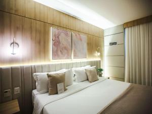 Ein Bett oder Betten in einem Zimmer der Unterkunft Mercure Camboriu