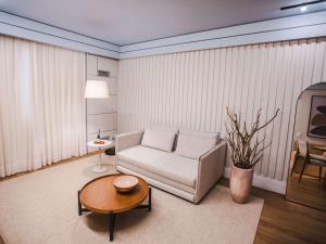 Ein Sitzbereich in der Unterkunft Mercure Camboriu