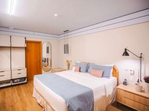 Ein Bett oder Betten in einem Zimmer der Unterkunft Mercure Camboriu