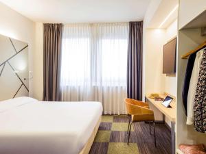 Postel nebo postele na pokoji v ubytování Mercure Milano Agrate Brianza