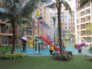 a playground with a water park with palm trees at Atlantis Condo Resort by Anatolii in Jomtien Beach