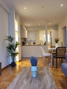 a living room with a couch and a table at 2 bd renovated flat at acropolis in Athens