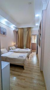 Voodi või voodid majutusasutuse Dkd-bridge Hotel toas