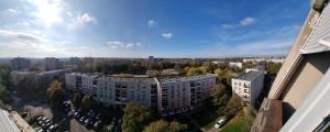 an aerial view of a city with tall buildings at Los Robles Avenue 2311 in Kaposvár