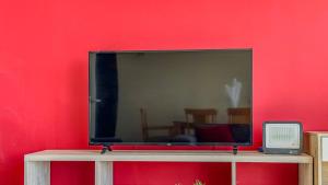 TV a/nebo společenská místnost v ubytování Condominio Costa Norte + 30 fotografií