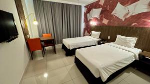 Postel nebo postele na pokoji v ubytování Hotel Cassino Tower Piracicaba by Nacional Inn