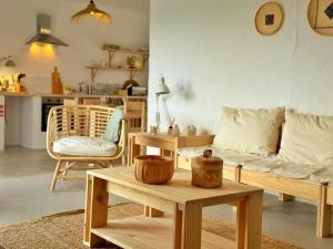 a living room with a couch and a table at Casa Verde Oliva Alentejo in Alandroal