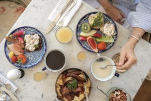 a table with three plates of food on it at Villa Strandvägen in Ystad