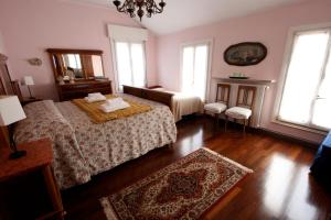Postel nebo postele na pokoji v ubytování Corte Posta B&B - parcheggio e bagno in camera
