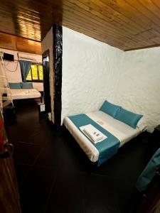 Postel nebo postele na pokoji v ubytování Hotel Mawill