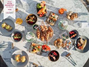 a table with a bunch of food on it at Boho Club in Marbella