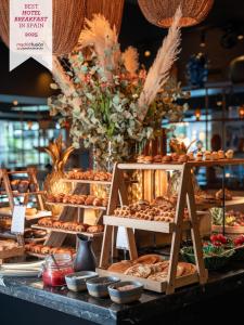 a display of bread and pastries on a table at Boho Club in Marbella