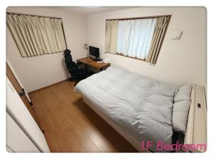 En eller flere senge i et værelse på Hao Bros Home Gemini B