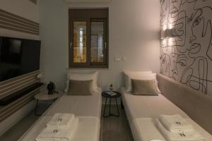 Ένα ή περισσότερα κρεβάτια σε δωμάτιο στο Pi Suite Project Smart Living