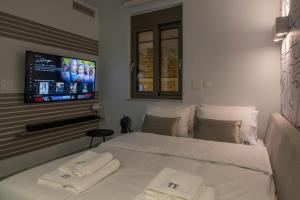 Ένα ή περισσότερα κρεβάτια σε δωμάτιο στο Pi Suite Project Smart Living