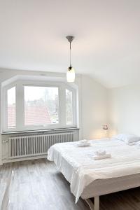 Postel nebo postele na pokoji v ubytování Säffle Suites by Svaneholm Hotel
