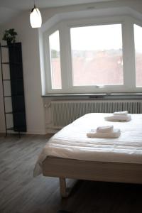 Postel nebo postele na pokoji v ubytování Säffle Suites by Svaneholm Hotel