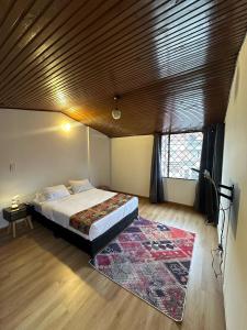 Cama o camas de una habitación en Bamuka Hostal