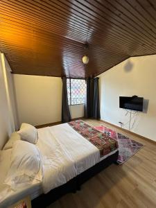 Cama o camas de una habitación en Bamuka Hostal